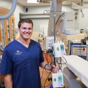 Daniel Connaughton in front of imaging equipment.