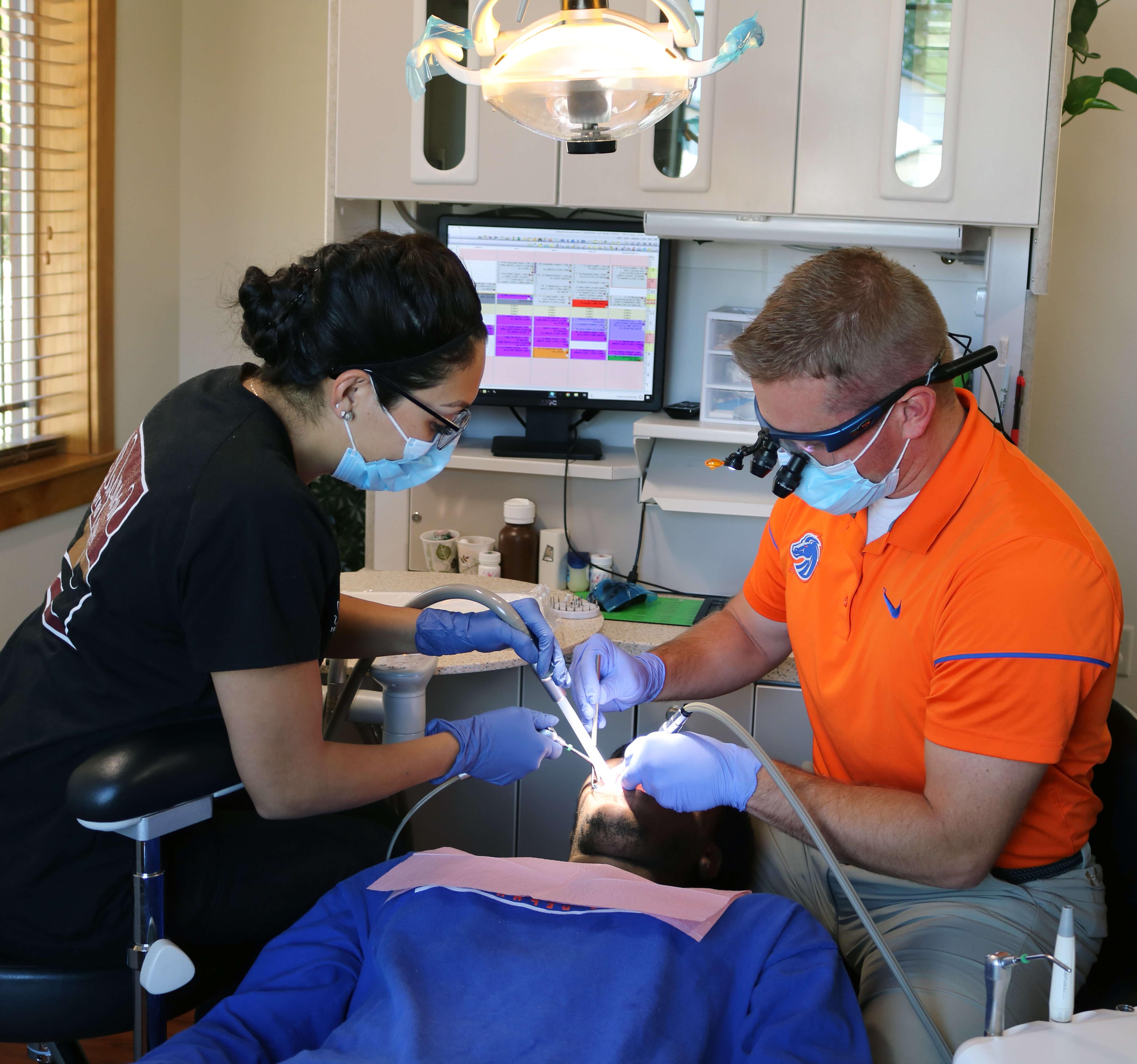 dentist and dental assistant