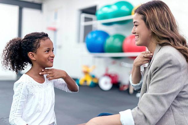 speech therapist working with a patient